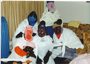 According to tradition, small groups of villagers in Newfoundland, or mummers, disguise their identities and go to other houses to threaten violence, as a means of establishing trust within a community.